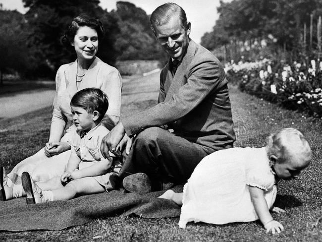 Queen Elizabeth II, and her husband Prince Philip, Duke of Edinburgh are seen with their two children, Charles, Prince of Wales (left) and Princess Anne (right). Picture: AFP