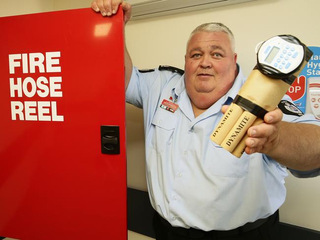 Insp Hetherington shows the dummy bomb used in simulations at RPA's new fire simulation unit. Picture: John Appleyard