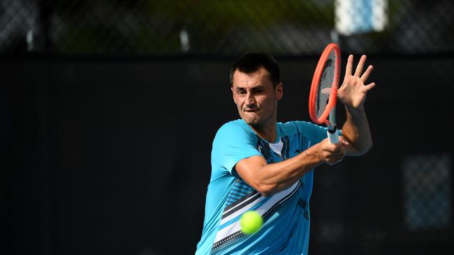 Bernard Tomic plays a shot during his match against Akira Santillan at the UTR Pro tennis tournament at the Queensland Tennis Centre in Brisbane. Picture: NCA NewsWire / Dan Peled