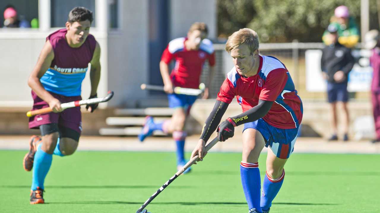 Darling Downs hockey player Carter Mogg takes on South Coast during the 13-19 years Boys Hockey State Championships. Picture: Nev Madsen