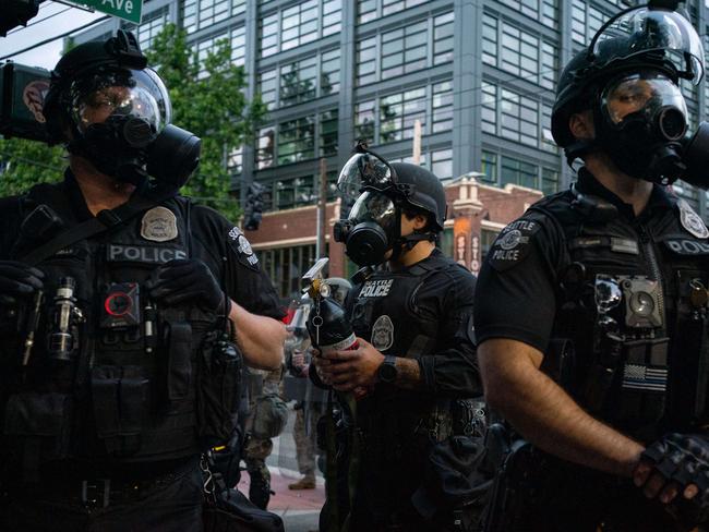 Police used flash bang devices and pepper spray to disperse a crowd of protesters in Seattle on Saturday night. Picture: AFP