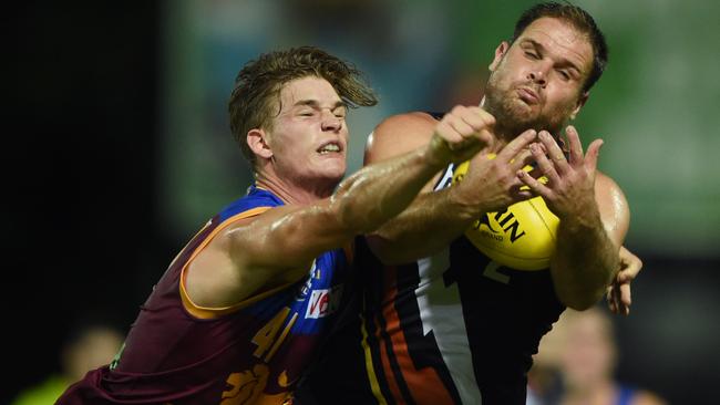 Sam Skinner attempts to spoil Darren Ewing in the NEAFL.