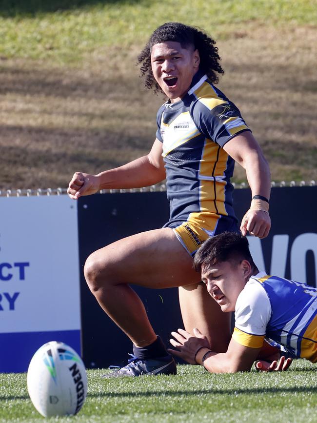 Luke Laulilii celebrates after scoring a runaway try in Westfields big win over Patrician Brothers Blacktown. Picture: Richard Dobson