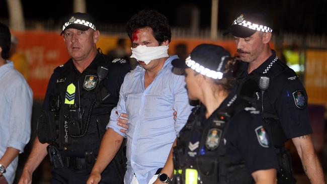 Man moved on by police at Schoolies 2019 Surfers Paradise AAP Image/Richard Gosling