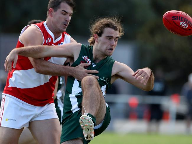 Glenroy skipper Travis Dulic tackles Airport West’s Angus Dunkley-Price. Picture: Mark Dadswell