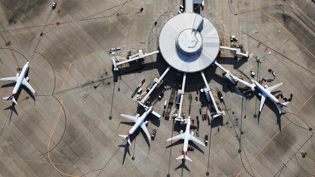 DO NOT USE BEFORE DEC 28TH, CONTACT COURIER MAIL PIC DESK Aerial images over Brisbane in summer. Qantas planes at Brisbane Domestic Airport.