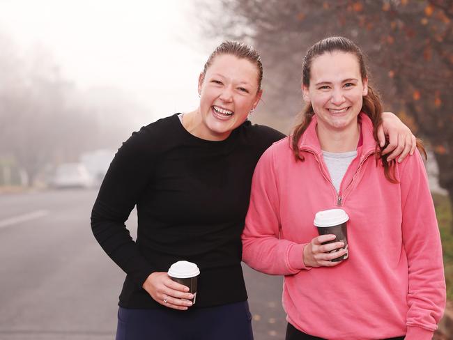 Embargoed for The daily Telegraph. Dubbo early morning / pre dawn run club. Gather to run and grab a coffee before work as a social activity. As opposed to going for a beer after work.  Zali Thomas with Harriet Spork and Kelpie Eddie.  Picture: Rohan Kelly