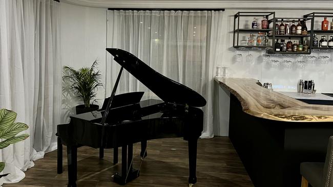 The bar has a digital grand piano for diners to listen to while enjoying a glass, or many, of wine. Photo: Sam Peterson.