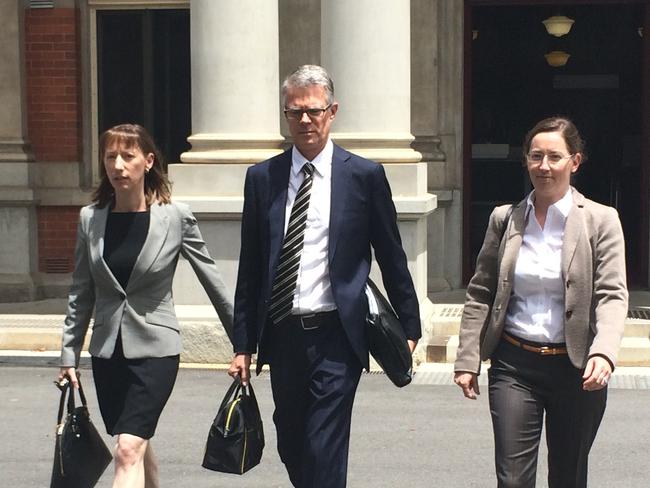 The two eldest daughters of the late iron ore baron Michael Wright, Leonie Baldock (left)and Alexandra Burt (right) leave the WA Supreme Court yesterday (today) with one of their lawyers (middle). Photo: Sonia Kohlbcher