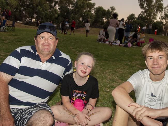 Aaron Day, Tayla Day and Jamie Day patiently await the fireworks display at Mildura's NYE 2024 celebrations. Picture: Noel Fisher