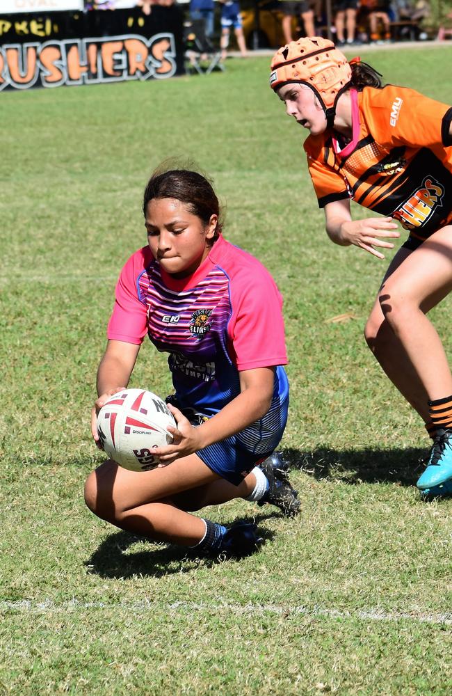 Taya Bowie evades Jess Furber to score a deserved try in August 2022. The Herbert River Junior Rugby League Club U15 girls’ teams versus Western Lions of Townsville at Artie Gofton Oval in Ingham. Picture: Cameron Bates