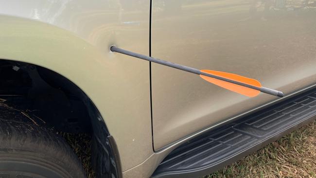 The crossbow bolt embedded in the side of the family's Toyota Prado. Picture: NTPFES