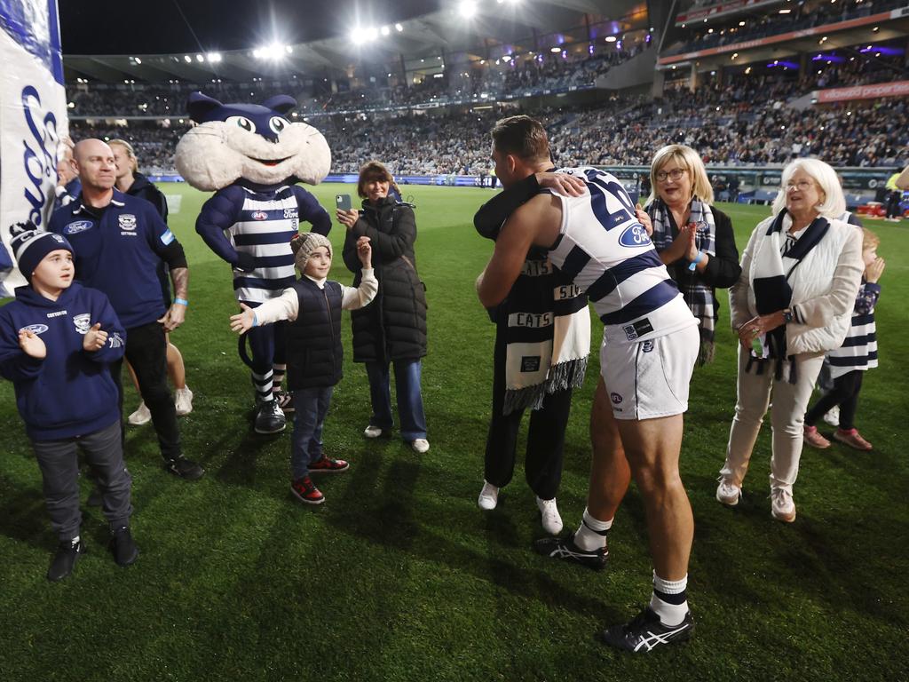 Tom Hawkins embraces family and friends before his record-equalling game. Picture: Darrian Traynor/Getty Images