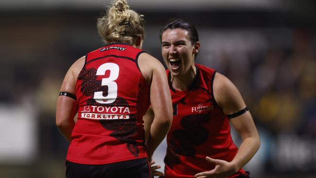 Daria Bannister and Bonnie Toogood celebrate a goal during Essendon’s win. Picture: Daniel Pockett/Getty Images