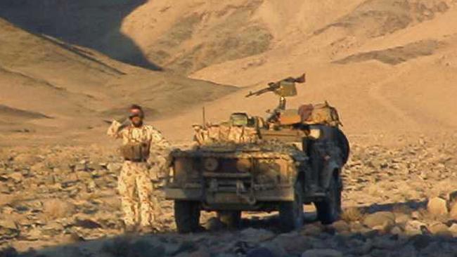 An Australian SAS soldier with his long range patrol vehicle in Southern Afghanistan in 2002. Picture: File