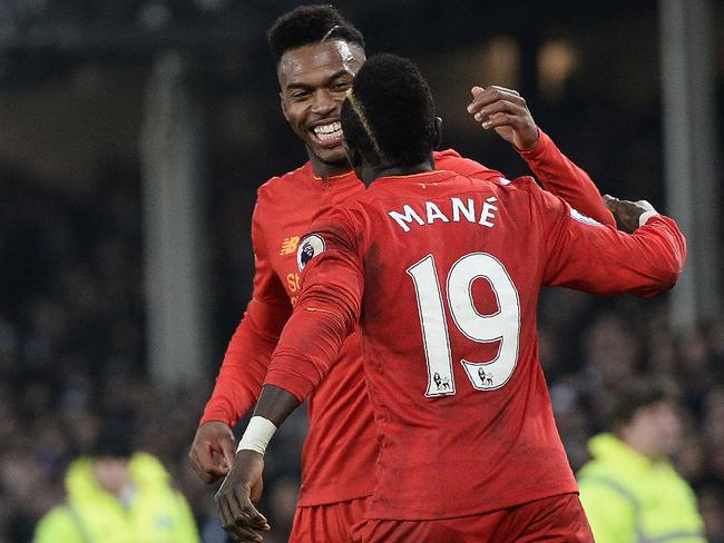 Liverpool's Senegalese midfielder Sadio Mane (R) celebrates.