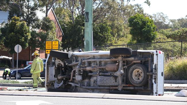 A ute on it side after crashing while being chased by police in Southport this morning. Picture: Glenn Hampson.