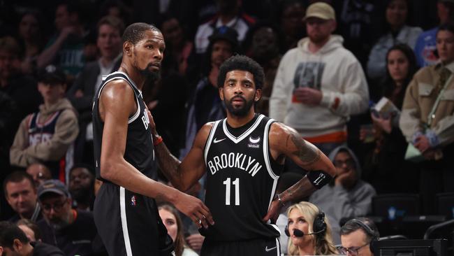 NEW YORK, NEW YORK - APRIL 23:  Kevin Durant #7 and Kyrie Irving #11 of the Brooklyn Nets look on in the final seconds of their 109-103 loss against the Boston Celtics during Game Three of the Eastern Conference First Round NBA Playoffs at Barclays Center on April 23, 2022 in New York City.  NOTE TO USER: User expressly acknowledges and agrees that, by downloading and or using this photograph, User is consenting to the terms and conditions of the Getty Images License Agreement.  (Photo by Al Bello/Getty Images).