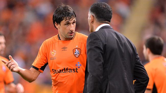 Thomas Broich of the Roar talks tactics with John Aloisi.