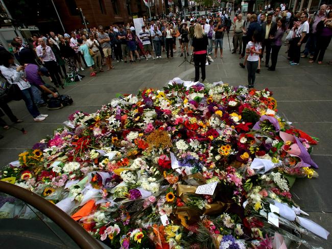 The growing mass of flowers at the Martin Place memorial. Picture: Adam Ward