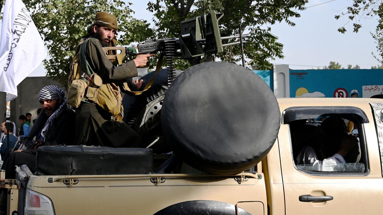 Taliban fighters travel with weapons mounted on a vehicle in Kabul. Picture: Wakil Kohsar/AFP