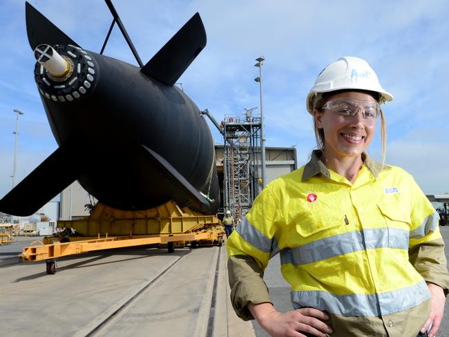 ASC rolls out HMAS Farncomb from the maintenance shed. Mechanical Fitter Deb Spence (30) who did her apprenticeship with ASC is happy with the move. She has been with the company 12yrs and manages 10 tradesmen who worked on the sub. Picture: Tricia Watkinson.