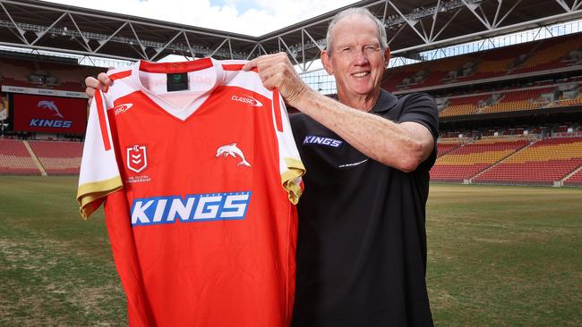 Coach Wayne Bennett holding the first Dolphins jersey, The Dolphins announce a sponsor and their first jersey, Suncorp Stadium, Milton. Picture: Liam Kidston.