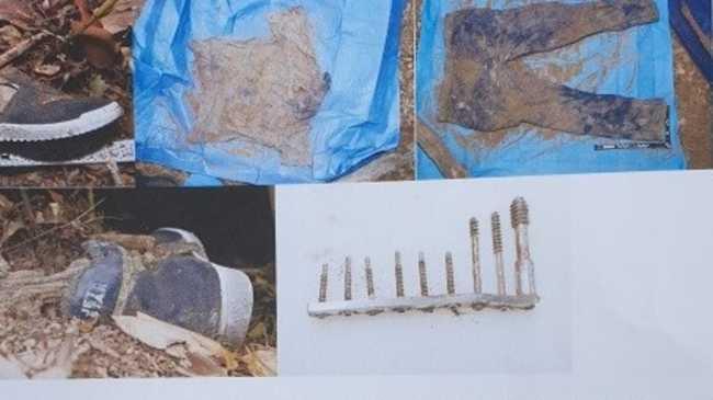 Items found at the scene of the discovery of human remains near Gympie last month, including shirt, pants, shoes and a hip bone plate. The mystery into the human remains found near Gympie deepens.