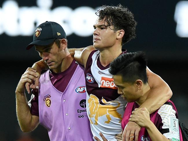 GOLD COAST, AUSTRALIA - MARCH 08: Cam Rayner of the Lions leaves the field injured during the AFL Community Series match between the Gold Coast Suns and the Brisbane Lions at Metricon Stadium on March 08, 2021 in Gold Coast, Australia. (Photo by Matt Roberts/AFL Photos/via Getty Images)