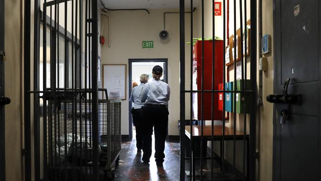 Correctional officers walk through a Long Bay Jail accommodation wing. Picture: Jane Dempster