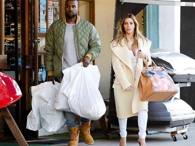 Out shopping for ski supplies with his lady love, Kim Kardashian, on Boxing Day. 