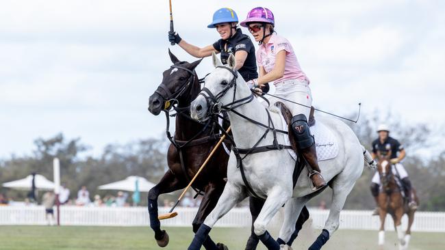 Zara Tindall and Delfina Blaquier in action during the Magic Millions polo. Picture: Luke Marsden