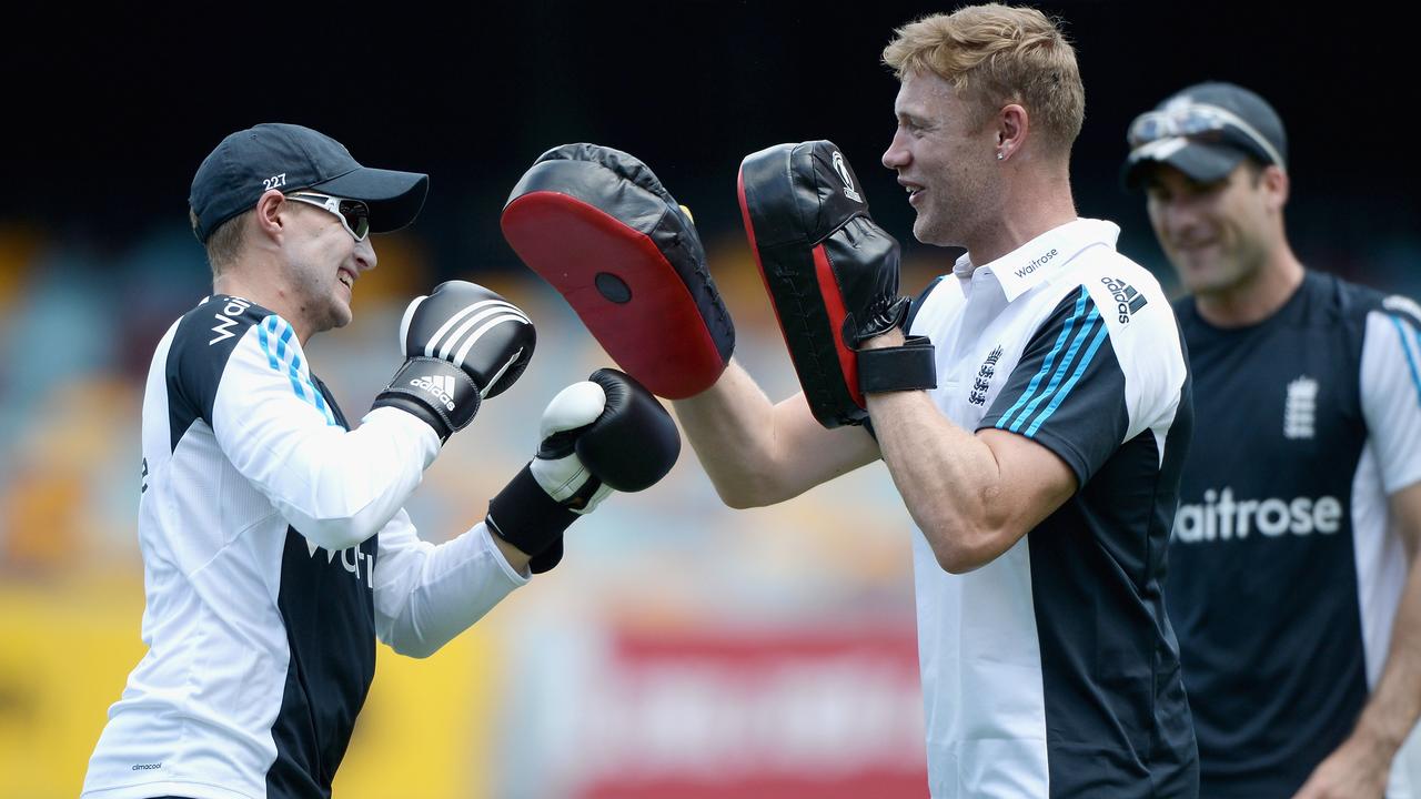 BRISBANE, AUSTRALIA - JANUARY 18: Former England cricketer Andrew Flintoff holds pads as Joe Root of England boxes ahead of a nets session at The Gabba on January 18, 2015 in Brisbane, Australia. (Photo by Gareth Copley/Getty Images)