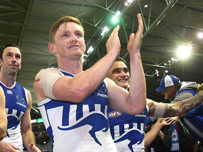 Delighter Kangaroos players mix with their fans after the win over the Magpies. Picture: AAP Image/Julian Smith