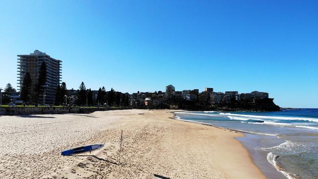 A deserted Manly Beach following its closure on April 05, due to people flouting COVID-19. Picture: Cameron Spencer/Getty Images.