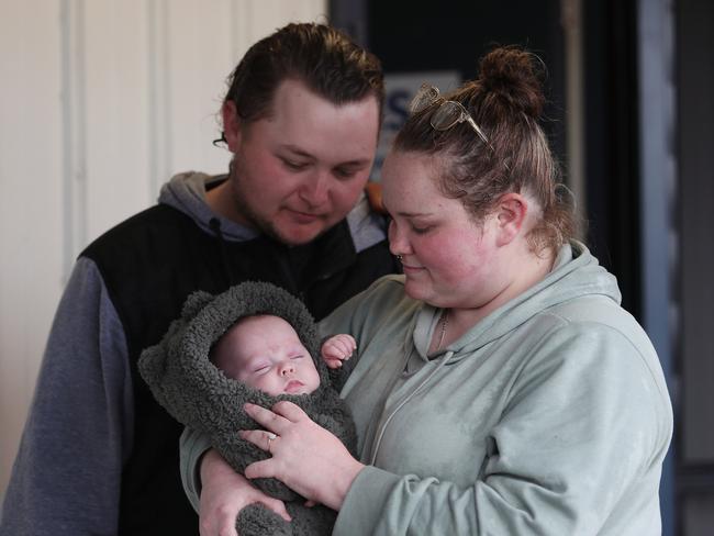 Parents Amber Hagan and Dylan Arnold with baby Theodore after being rescued at South Tacoma. Picture: Sue Graham