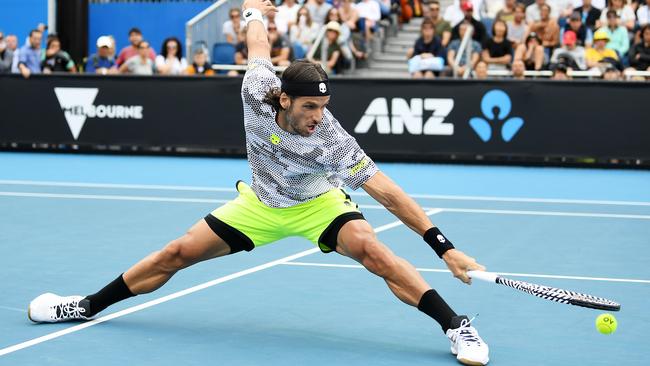 Feliciano Lopez stretches for a backhand during his Men's Singles first round match against Roberto Bautista Agut. Picture: Getty Images