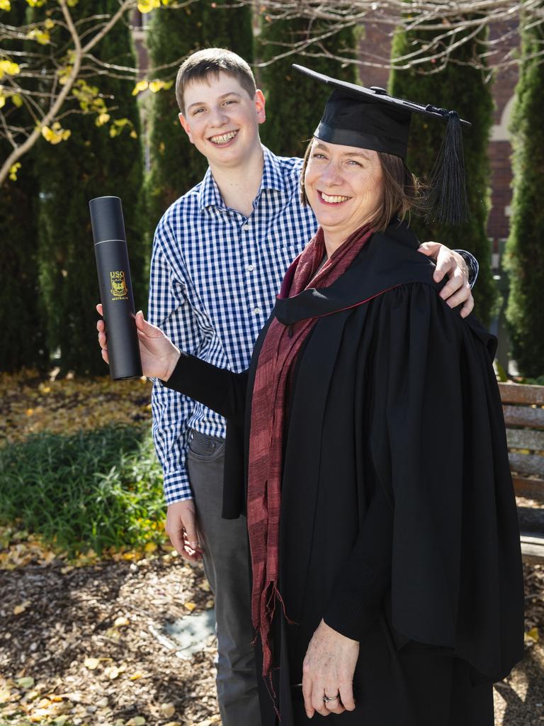 Curtis Cameron congratulates his mum Jenny Cameron on her Bachelor of Urban and Regional Planning degree at a UniSQ graduation ceremony at Empire Theatres, Wednesday, June 28, 2023. Picture: Kevin Farmer