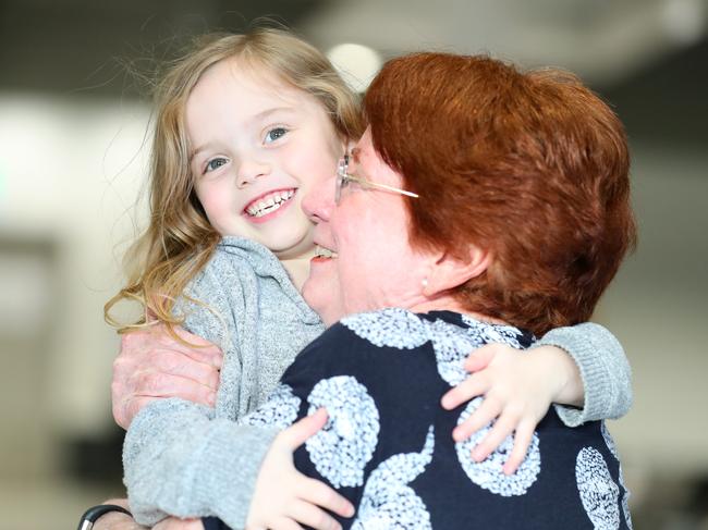 Grandma Susan Forster hugs five-year-old granddaughter Poppy Brecknock. Picture: Lachie Millard