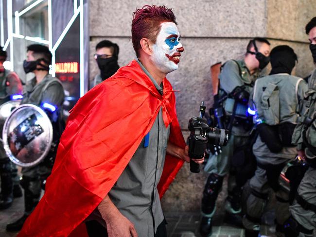 The Joker is a popular choice this year as Halloween revellers, encouraged by protesters, don masks to defy Beijing’s rule of no face coverings in public. Picture: AFP