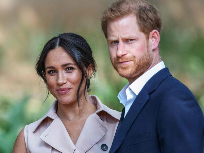 (FILES) In this file photo taken on October 02, 2019 Britain's Prince Harry, Duke of Sussex(R) and Meghan, the Duchess of Sussex(L) arrive at the British High Commissioner residency in Johannesburg where they  will meet with Graca Machel, widow of former South African president Nelson Mandela, in Johannesburg. - Prince Harry has filed a new claim for breach of privacy against British tabloid newspapers, media and the publishing group concerned said on October 4, 2019. (Photo by Michele Spatari / AFP) / France OUT until 2019-10-17T00:00:00.000+02:00