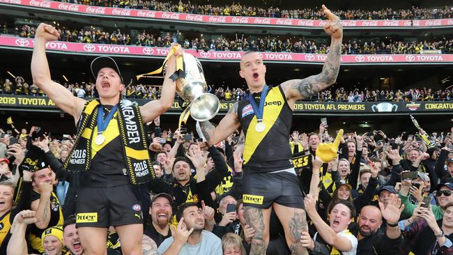 Liam Baker and Dustin Martin celebrate the 2019 premiership. Picture: Alex Coppel.