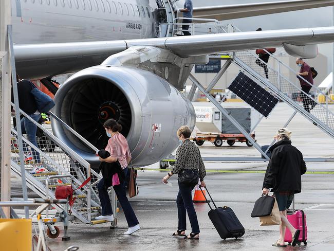 Passengers begin to board their Jetstar flight. Picture: NCA NewsWire / Ian Currie