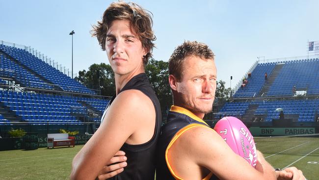 Thanassi Kokkinakis and Lleyton Hewitt show their Port and Crows colours ahead of a Showdown in 2015.