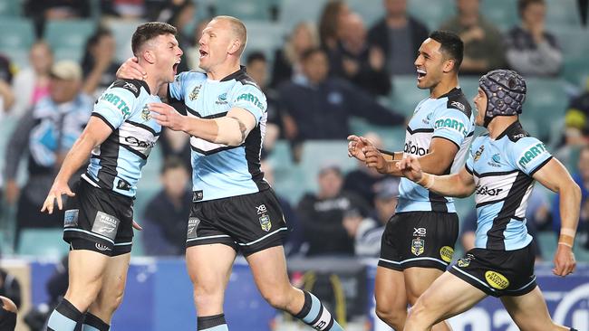 Chad Townsend celebrates with his Sharks teammates after scoring a try. Picture: Getty Images