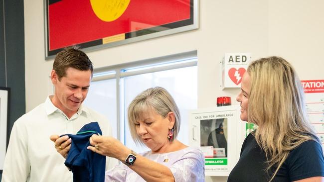 Principal of Darwin Middle School, Ben McCasker (left), Minister for Education and Training Jo Hersey (middle) and Department of Education and training rep Sandy Evans for the Back To School vouchers.