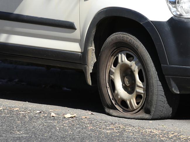 Tasmanian Police investigate numerous cars that had their tyres slashed on Pine Street, West Hobart overnight.   Pine Street. Picture: Zak Simmonds