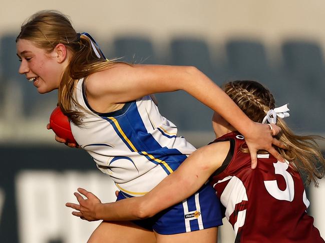 Gabby Mehrmann of Padua College is tackled by Teagan Murtic of Our Lady of Sion College in action during the 2023 Herald Sun Shield Division 2 Intermediate Girls grand final. (Photo by Michael Willson/AFL Photos)