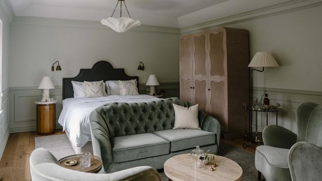 Suite accommodation is in a restful palette of sage.