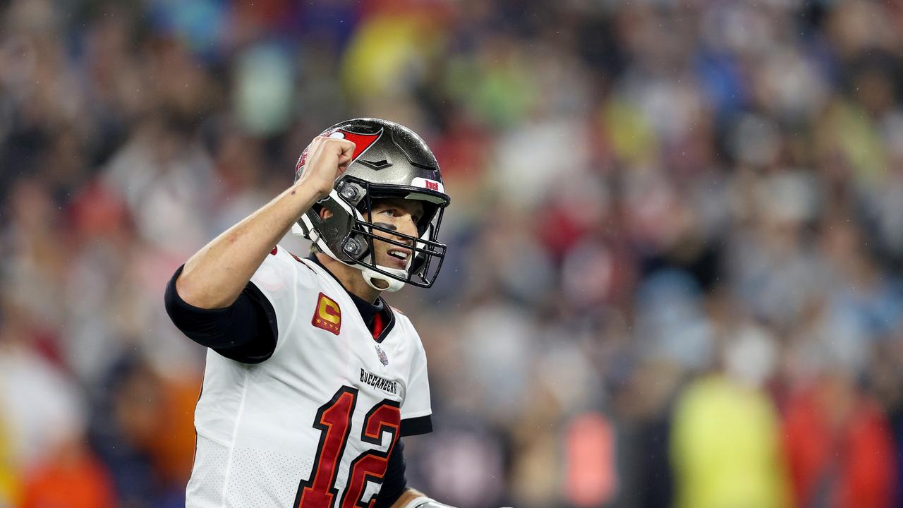 FOXBOROUGH, MASSACHUSETTS - OCTOBER 03: Tom Brady #12 of the Tampa Bay Buccaneers celebrates a touchdown against the New England Patriots during the third quarter in the game at Gillette Stadium on October 03, 2021 in Foxborough, Massachusetts. (Photo by Maddie Meyer/Getty Images)